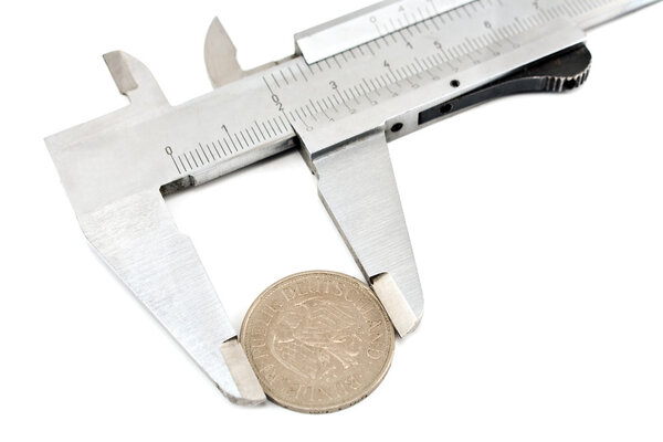 Measuring a one deutschmark coin with a caliper