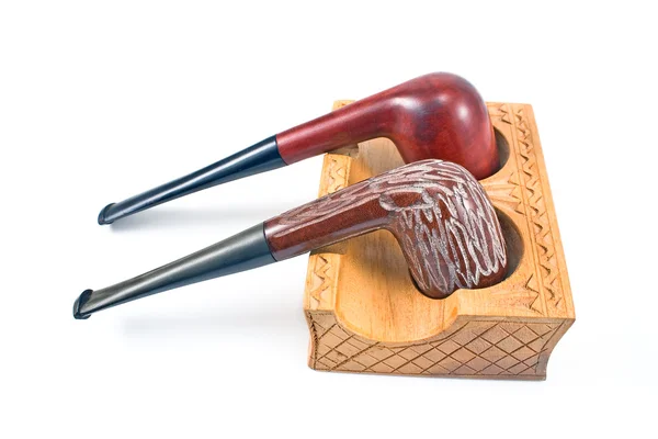 Twee tabak pijpen op houten houder — Stockfoto