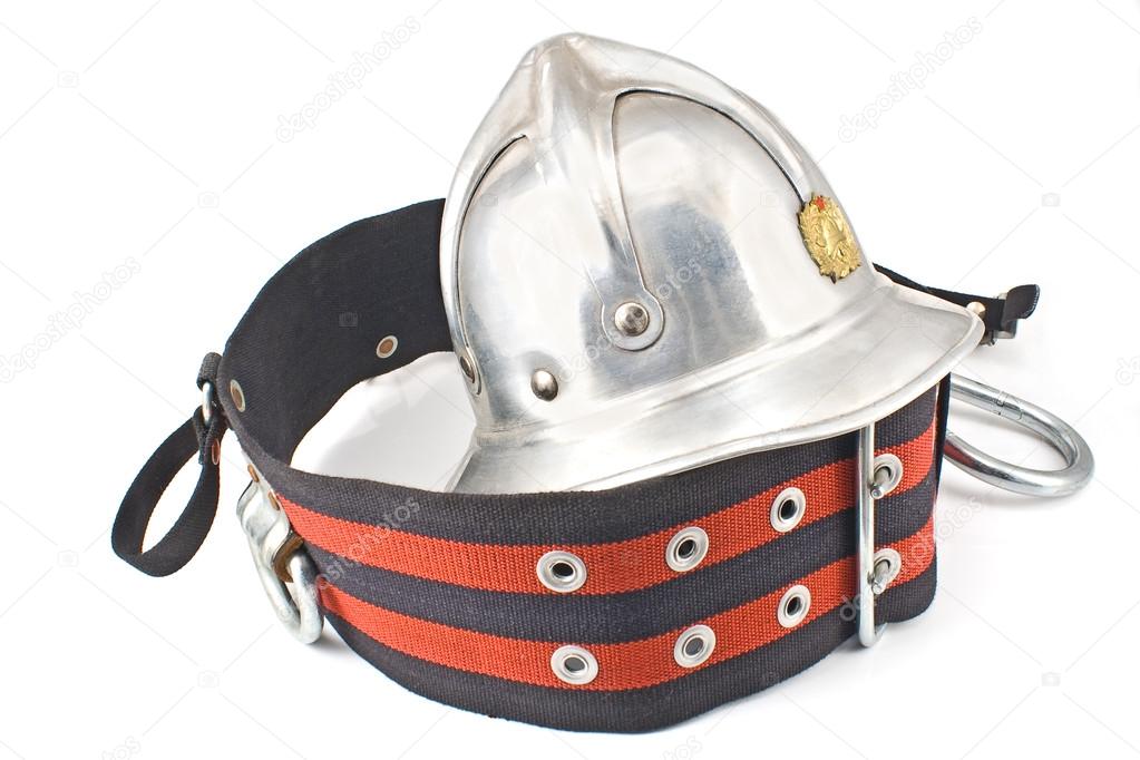 Old fireman's metallic helmet with belt