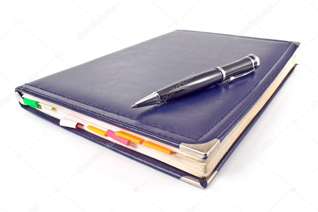Pen and blue notebook