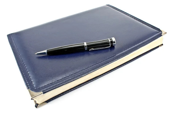 Pen en blauw notebook — Stockfoto