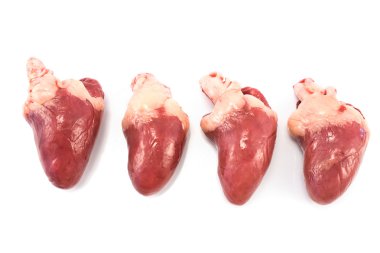 Four raw chicken hearts isolated on white clipart