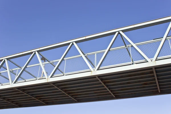 Pedestrian bridge over blue sky — Stok fotoğraf