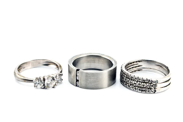 Tres anillos de plata aislados en blanco — Foto de Stock