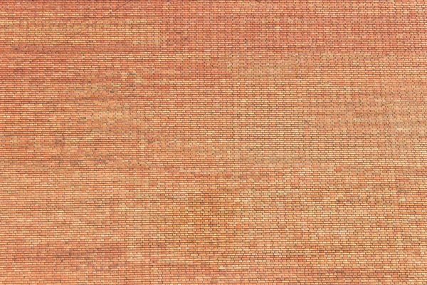 Büyük kırmızı tuğla duvar doku yüzeyinin — Stok fotoğraf