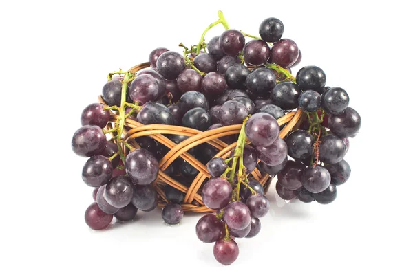 Dark grapes in a basket on white — Stock Photo, Image