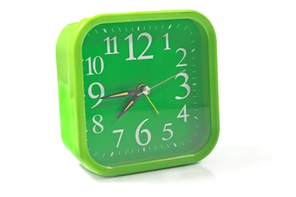 Reloj verde sobre blanco — Foto de Stock