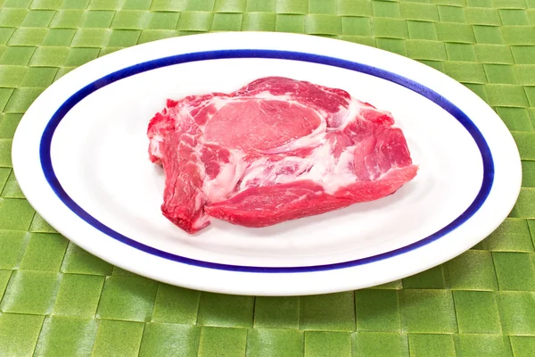 Pork neck chop meat on white plate — Stock Photo, Image