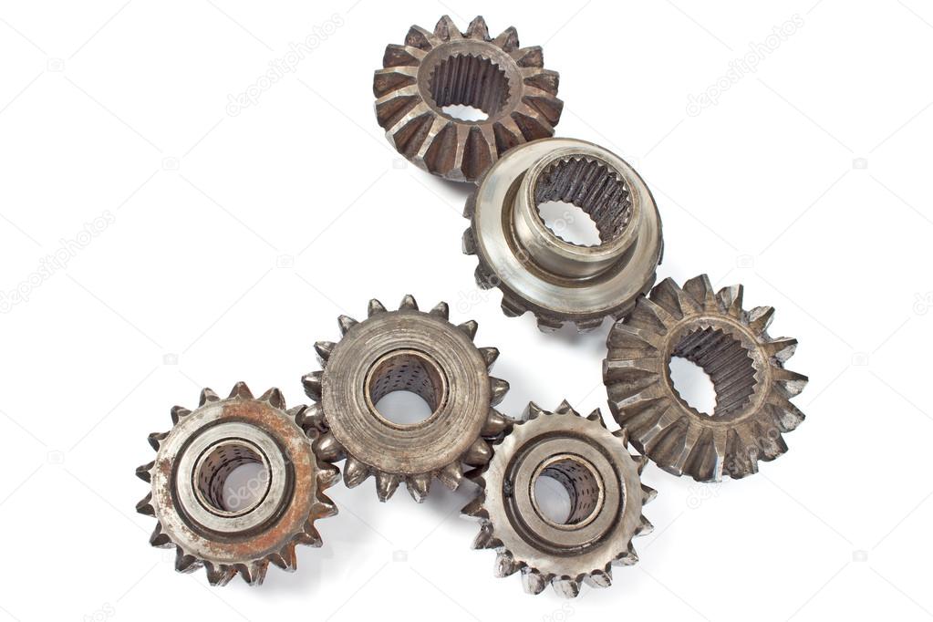 Old metal cogs isolated on white