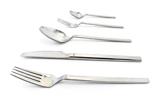 Bestick set med gaffel, kniv och sked isolerad på vit — Stockfoto