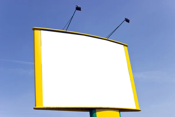 Blank yellow billboard over blue sky — 스톡 사진