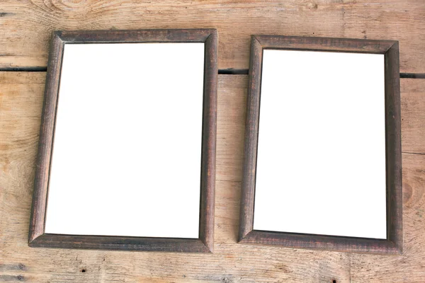 Dos viejos marcos de fotos sobre fondo de madera — Foto de Stock