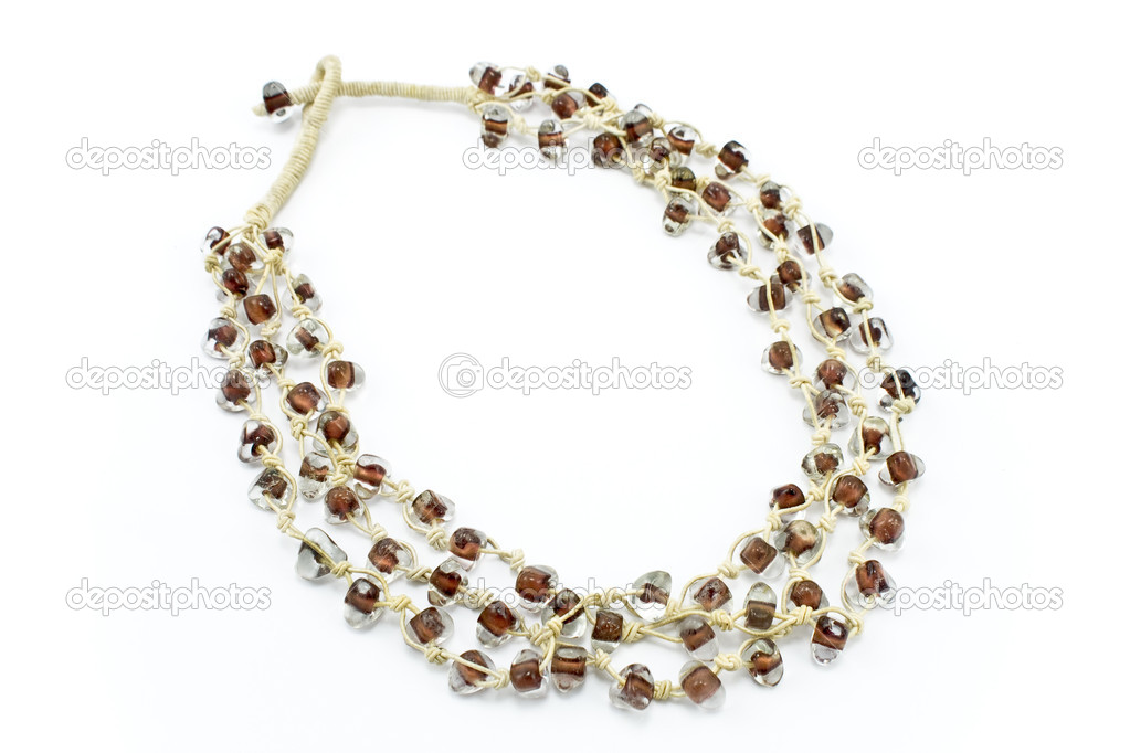 Necklace with glass beads and white ropes on white