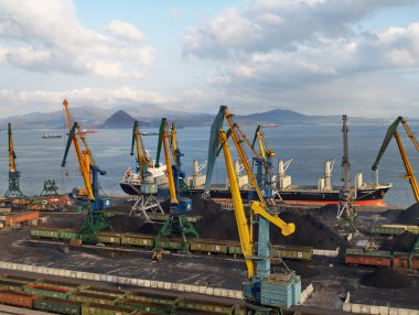 Coal loading on a vessel in port Nakhodka (Far East) clipart