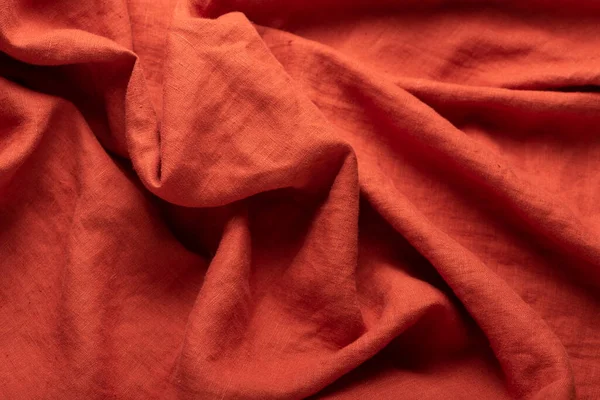 Taş yıkanmış keten kumaş, tuğla rengi, dikiş konsepti, seçici odak resmi