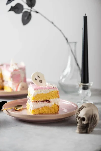 Halloween party decoration with pink cake, selective focus image