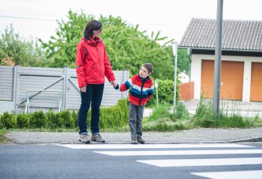 Mother and Son by the Crosswalk clipart