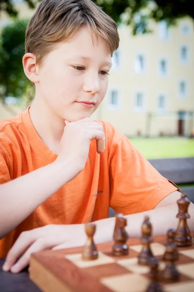 Thinking Boy in a Chess Game — Stock Photo, Image