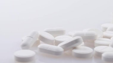 4k panning footage from generic pharmaceutical pain drugs to orange prescription pill bottle of opioids concept for opioid epidemic, painkiller medicine addiction, addictive medication and drug abuse