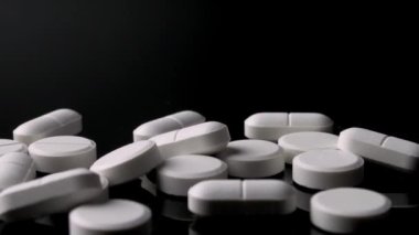 4k panning footage from generic pharmaceutical pain drugs to orange prescription pill bottle of opioids concept for opioid epidemic, painkiller medicine addiction, addictive medication and drug abuse