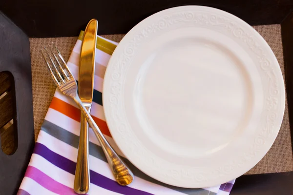 Empty plate with cutlery — Stock Photo, Image