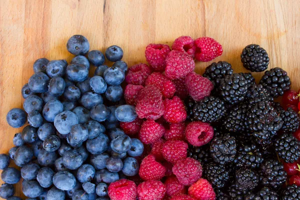 Ripe of fresh berries on table — Stock Photo, Image