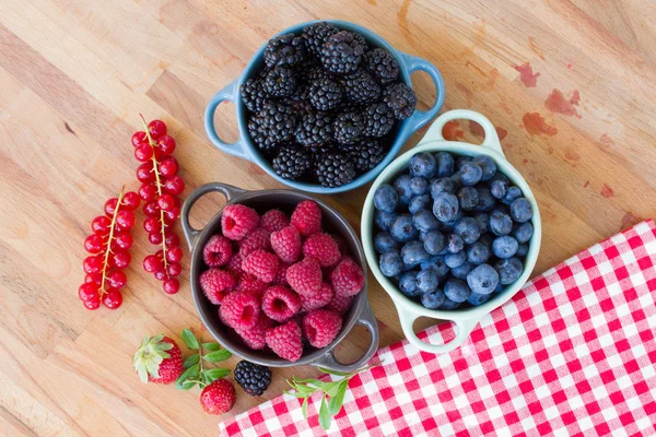 Three bowls of fresh raspberry — Stock Photo, Image
