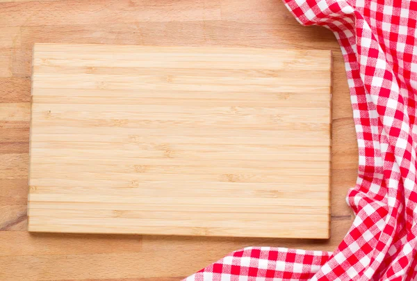 Cutting board and red napkin — Stock Photo, Image