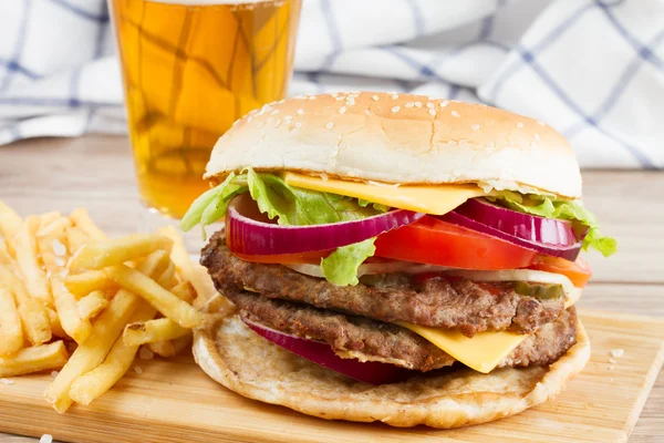 Big burger with french fries and beer — Stock Photo, Image