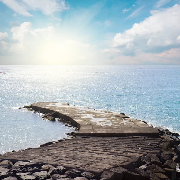 Stone pier at sunny day