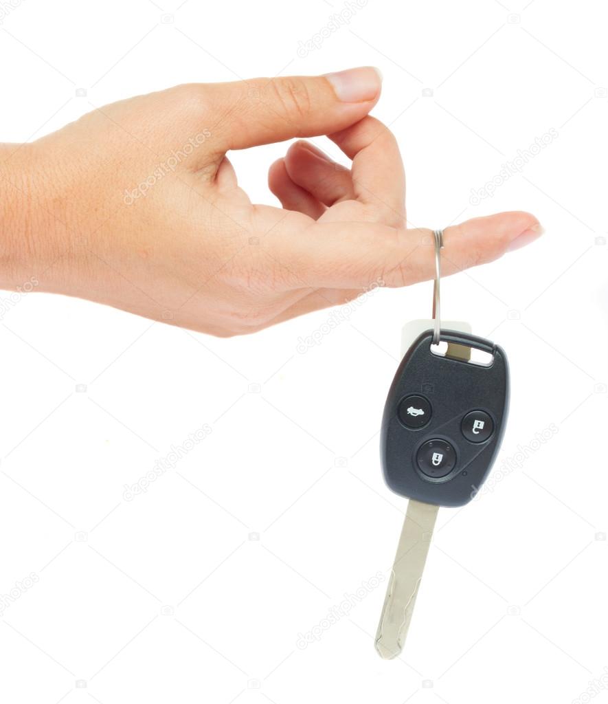 Hand holding a car key