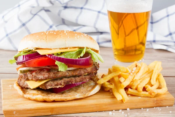 Big hamburger with french fries and beer — Stock Photo, Image