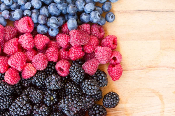 Ripe of fresh berries on table — Stock Photo, Image
