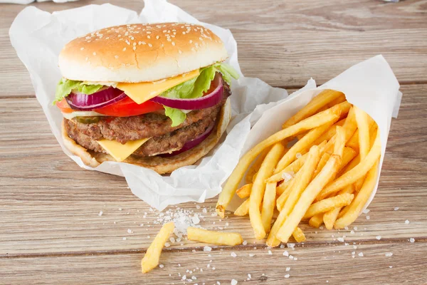 Big hamburger with french fries — Stock Photo, Image