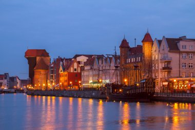 Motlawa river  and old  Gdansk at night clipart