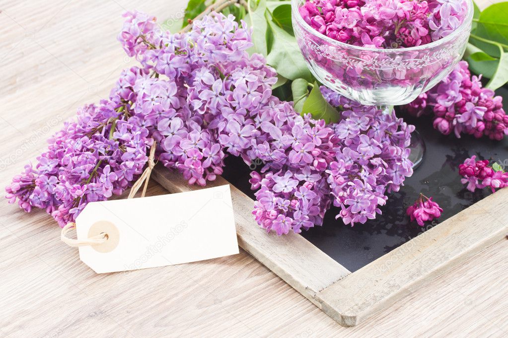 Lilac on table with empty tag