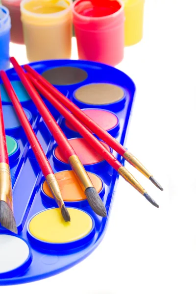 Paints and brushes — Stock Photo, Image