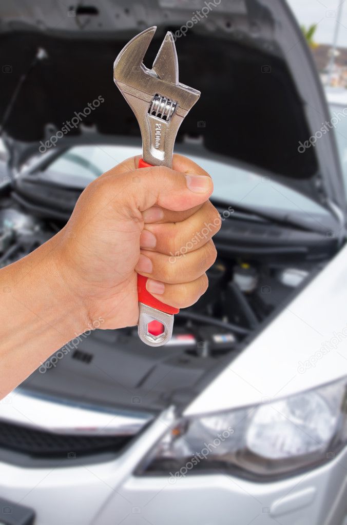 Auto mechanic hand with wrench