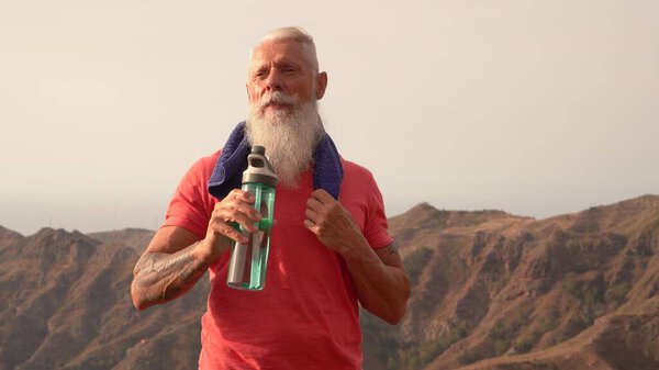 Senior man doing sport exercises
