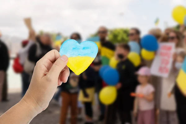 Hand Holding Heart Colors Ukranian Flag Rally War Support Ukraine — Stock fotografie