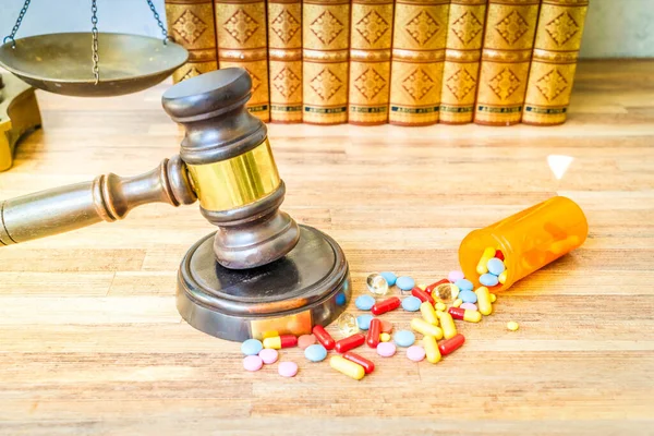view of law gavel, stethoscope and pills, medical law concept, toned