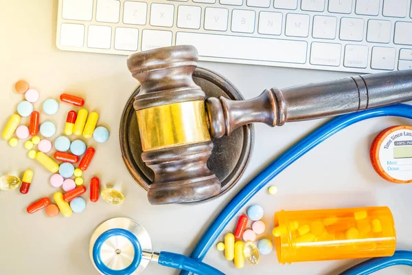 law gavel, stethoscope and pills, medical law concept, copy space