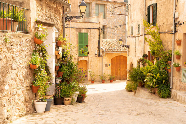 Street in old town of Valdemossa with traditional flower pots, Majorca, Spain, Belearic islands