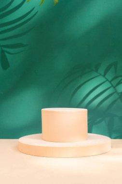 Minimal modern product display on green jungle background with palm leaves and shadow overlay