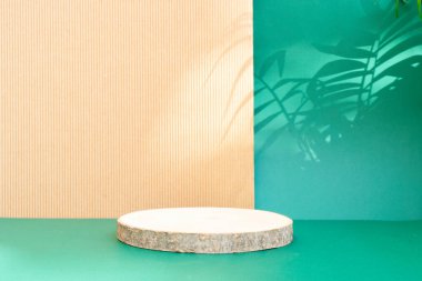 Minimal modern product display podium on reach green and textured brown background with wooden podium and shadow overlay