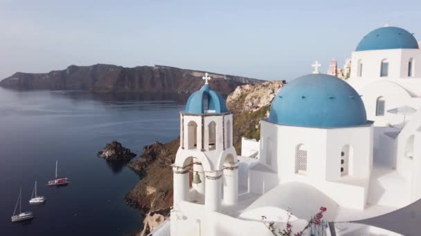 Establishing Shot Oia White Church Belfry Blue Domes Volcano Caldera — 비디오