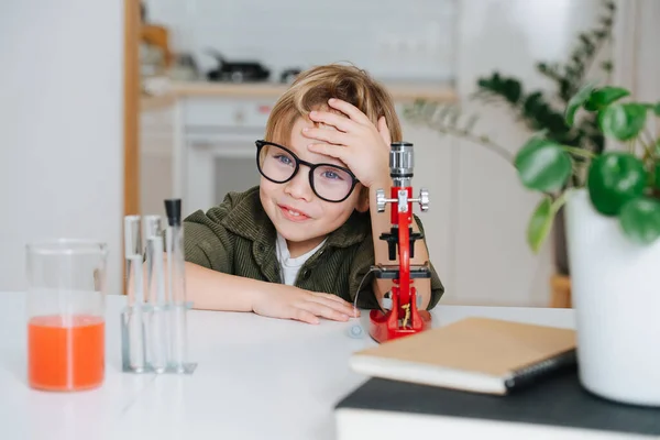Smiling Little Boy Glasses Sitting Table Front Microscope Kitchen Listening — 图库照片
