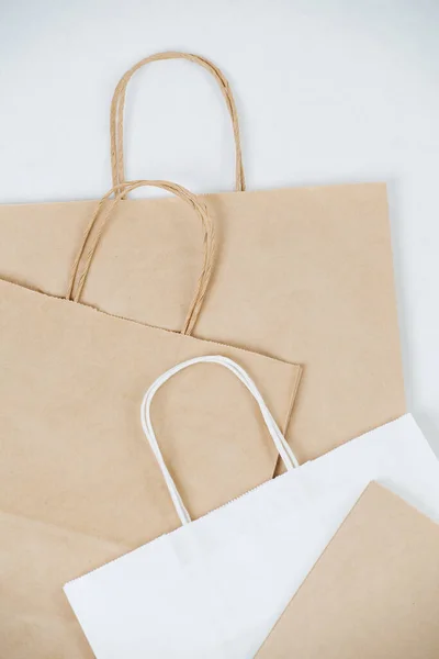 Close Flat Empty Brown Paper Bags White Surface Rope Handles — Stockfoto
