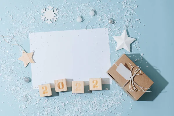 Blank sheet of paper surrounded by new year decoration Stock Picture