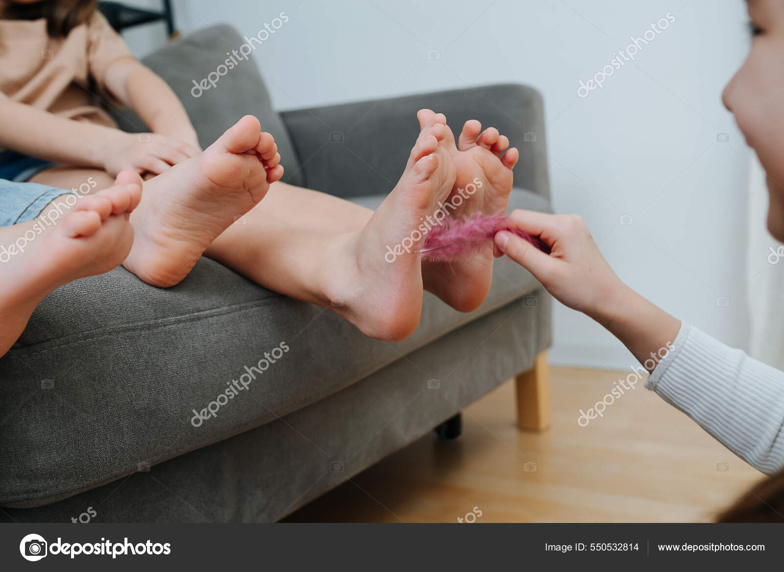 Children's Feet Being Tickled Pink Feather Laughing Girl Focus Feet Stock  Photo by ©zzzdim 550532814